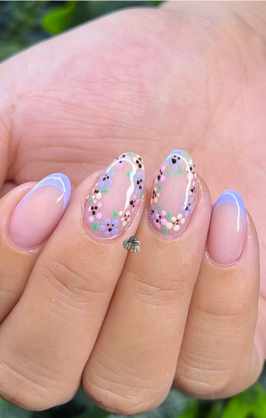 Short nude nails with pastel floral art and periwinkle outlines