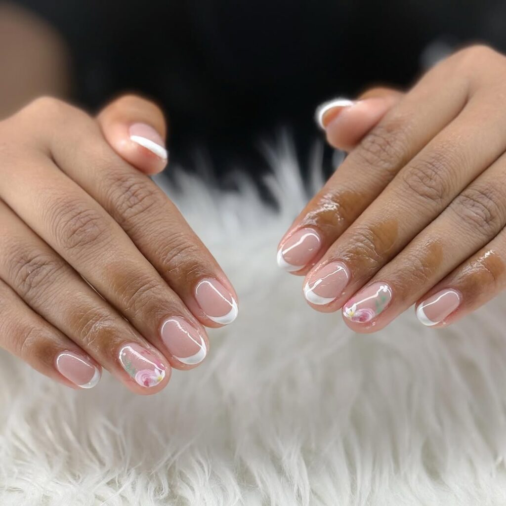 french manicure with tiny flower accents