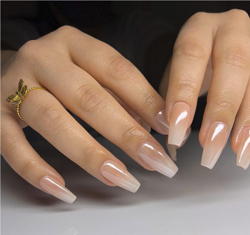Milky nude ombre nails with a glossy glazed finish