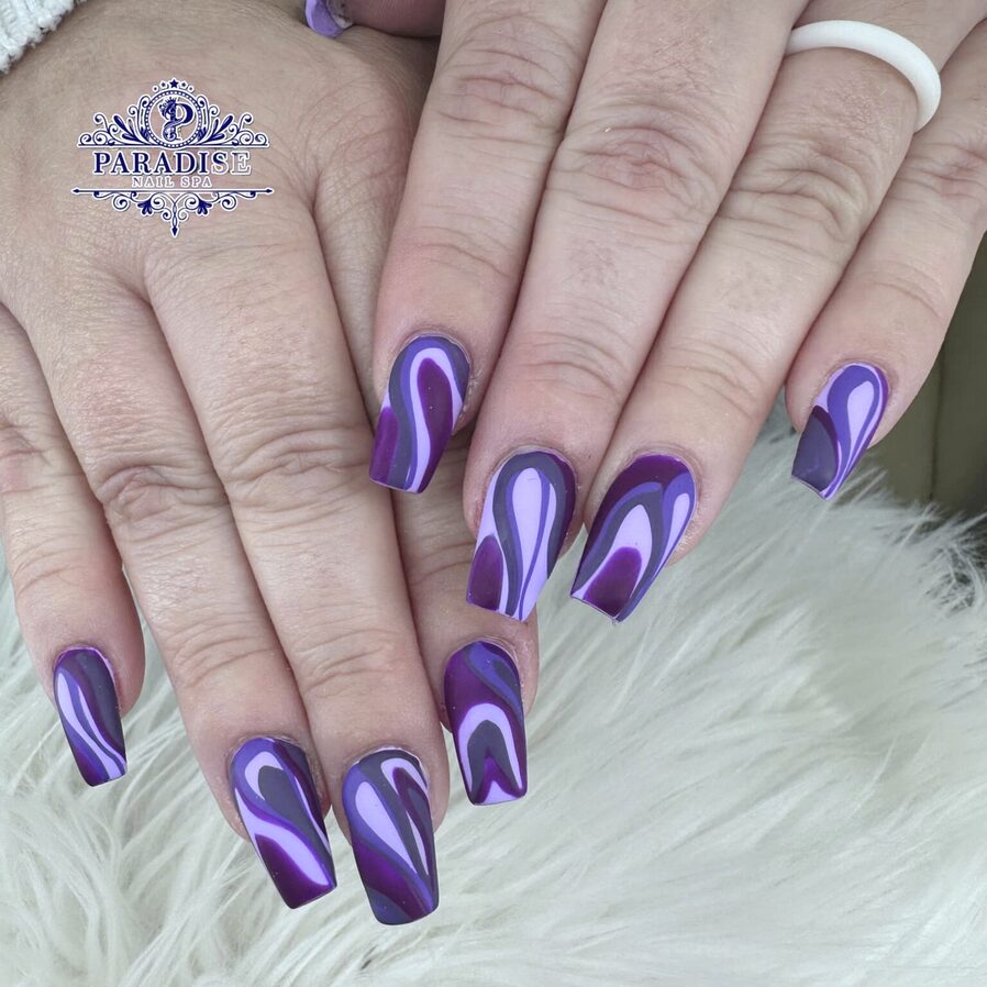 Glossy purple square nails with bold two-tone swirl designs