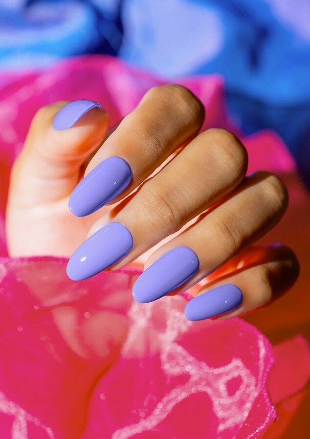 Glossy pastel periwinkle nails with an almond shape