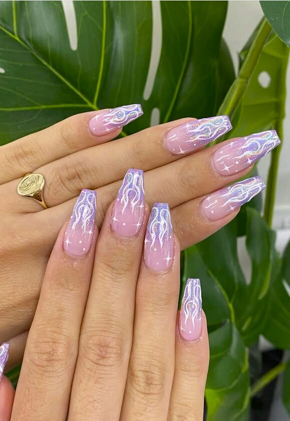 Long square nails with a soft pink ombre base and holographic lavender flame designs