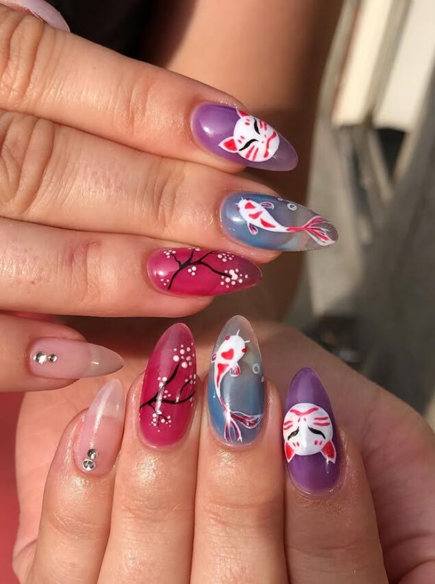 Colorful nails featuring koi fish, cherry blossoms, and fox mask designs