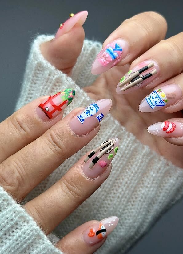 Close-up of hands with long nails featuring colorful Japanese-themed nail art designs.