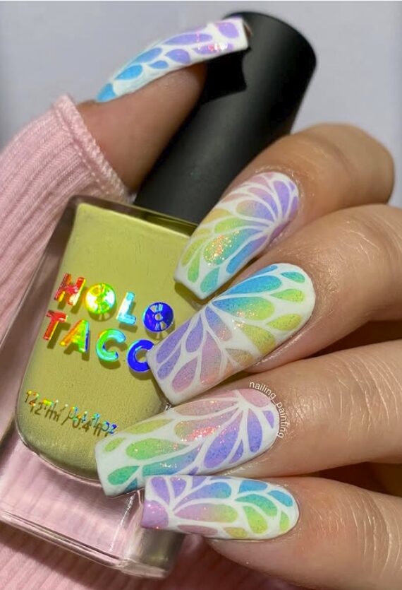 Long white nails with rainbow butterfly-wing patterns and subtle shimmer