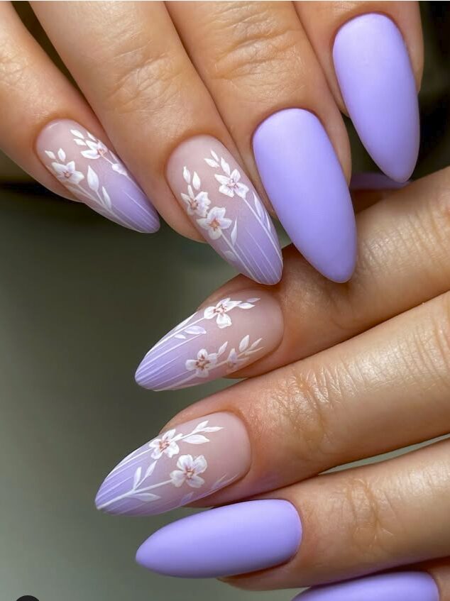 Lavender matte almond nails with delicate white floral accents