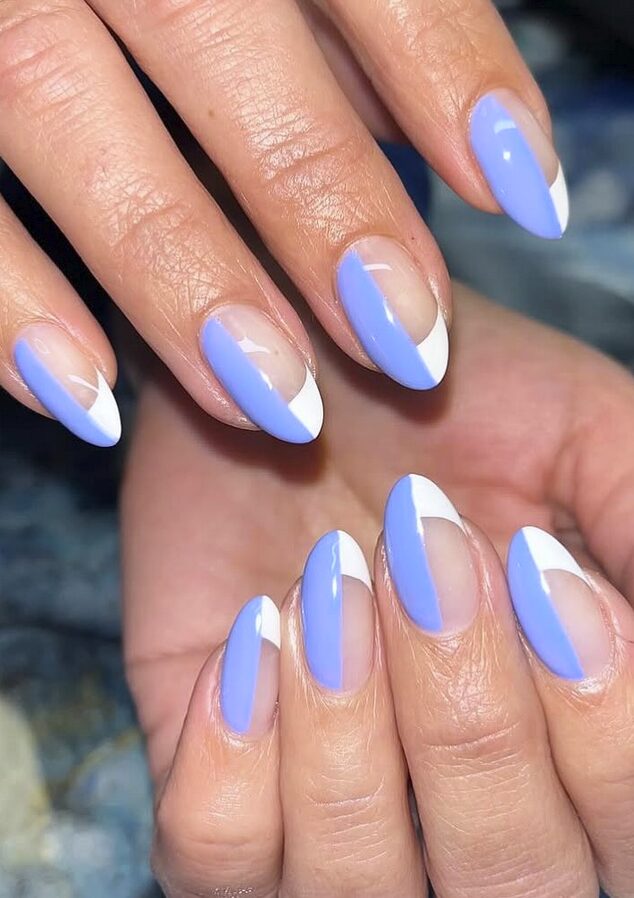 light purple nails with white diagonal accents and negative space