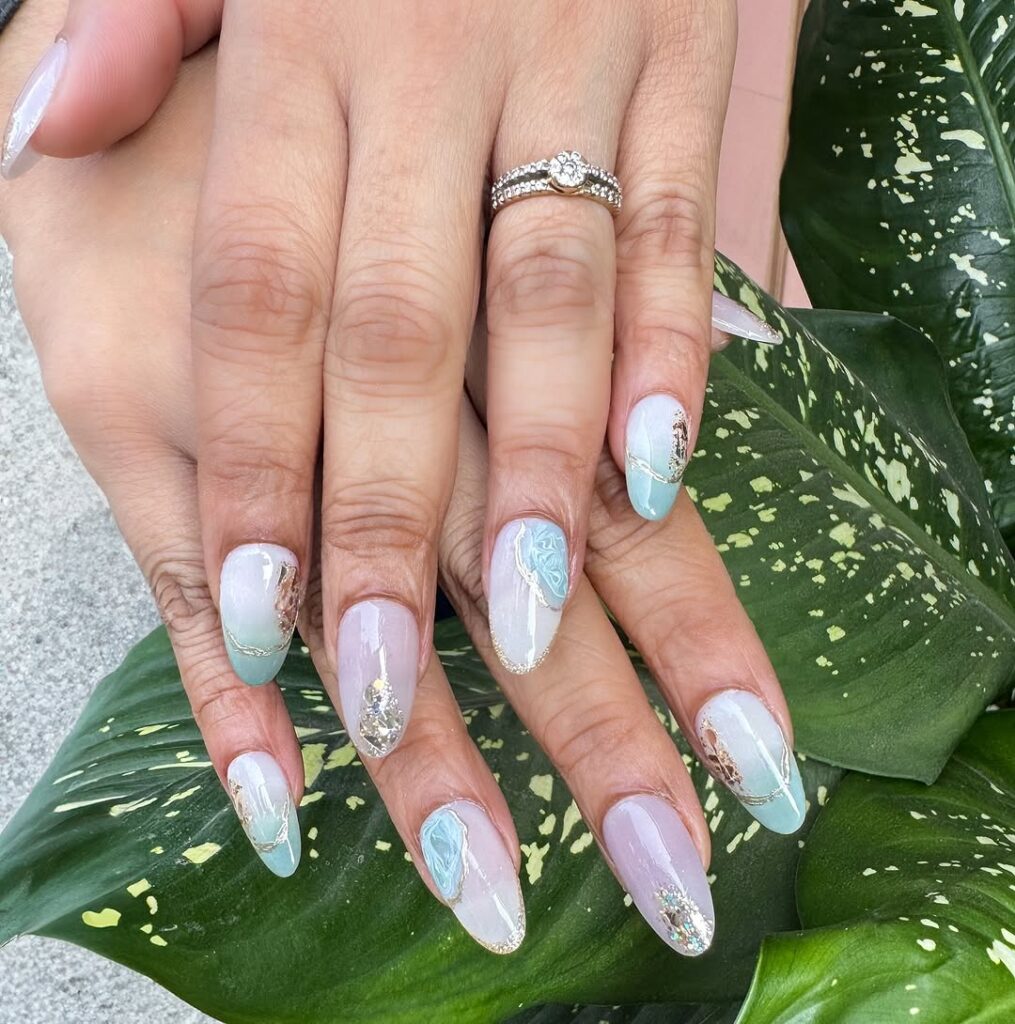 fresh mint green nails with gold foil accents