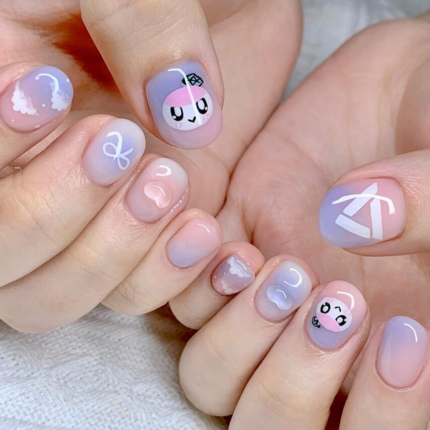 Pastel short nails with cute character faces, clouds, and minimal line art