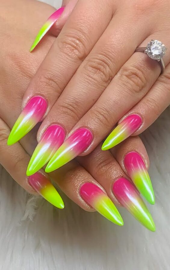 Long stiletto nails with neon pink-to-yellow ombré