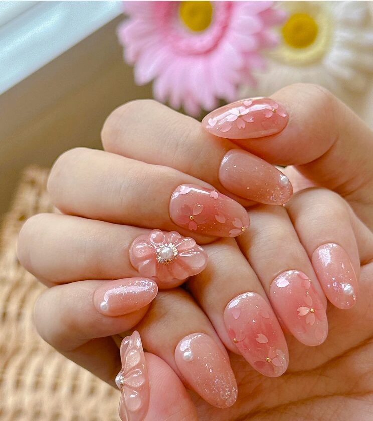 jelly nails with 3D floral designs, glitter, and delicate petal accents
