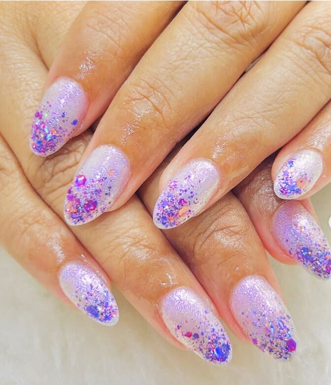 Lilac glitter nails with sparkly purple and pink flakes