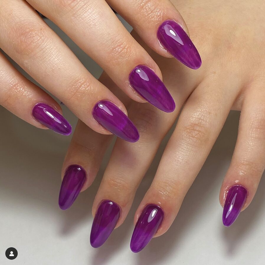 Glossy purple jelly almond nails