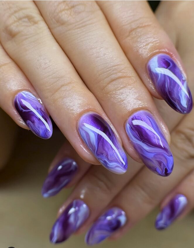 Purple marble almond nails with glossy swirled patterns