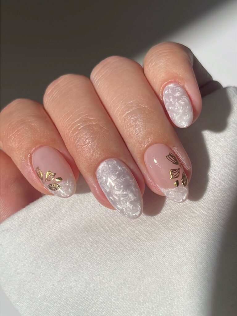 pearl core nails with gold accents