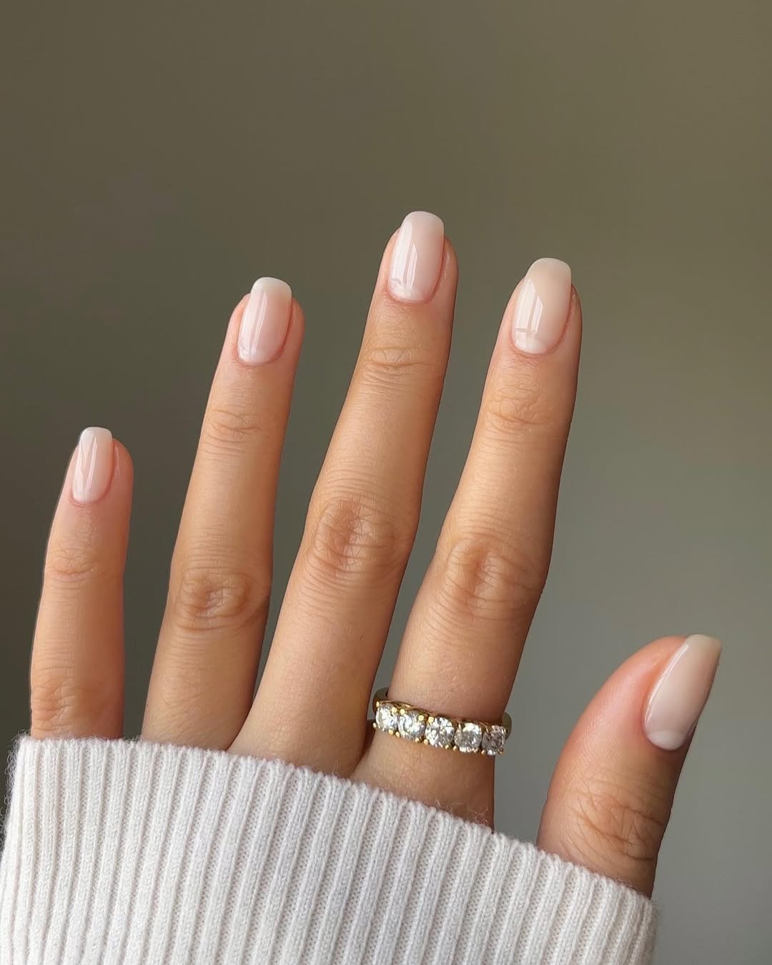 glossy milky nude spring manicure on short rounded nails