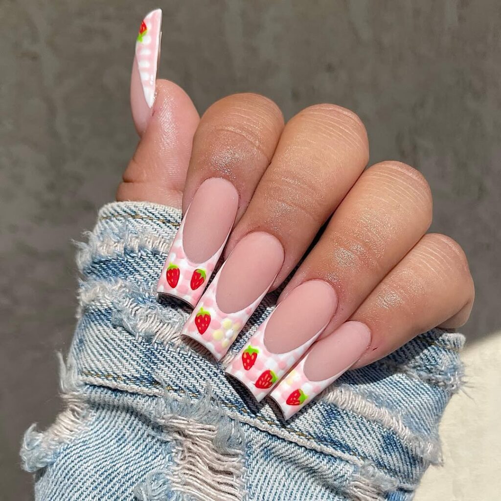 Cute strawberry nail design with red berries and green leaves