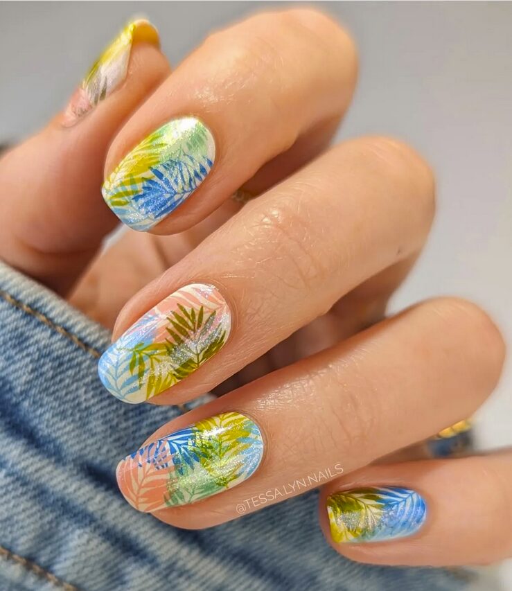 Pastel tropical nails with layered palm leaf designs