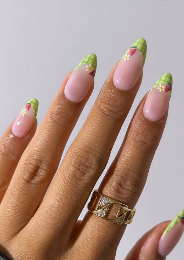 Pink nails with green French tips featuring tiny watermelon slices and flowers