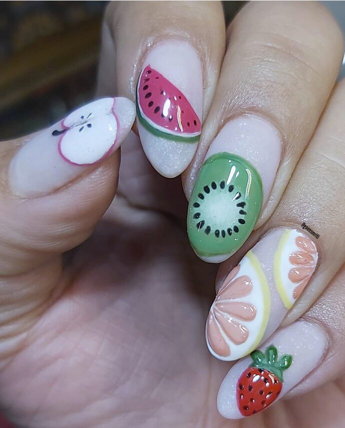 Colorful fruit nail art featuring watermelon, kiwi, grapefruit, apple, and strawberry designs