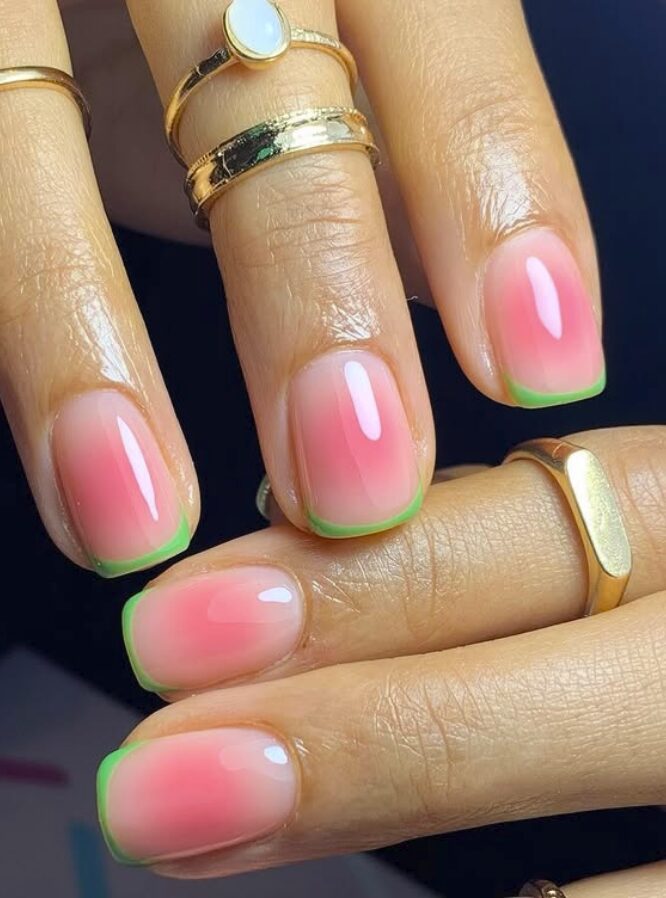 Pink ombré nails with thin green French tips