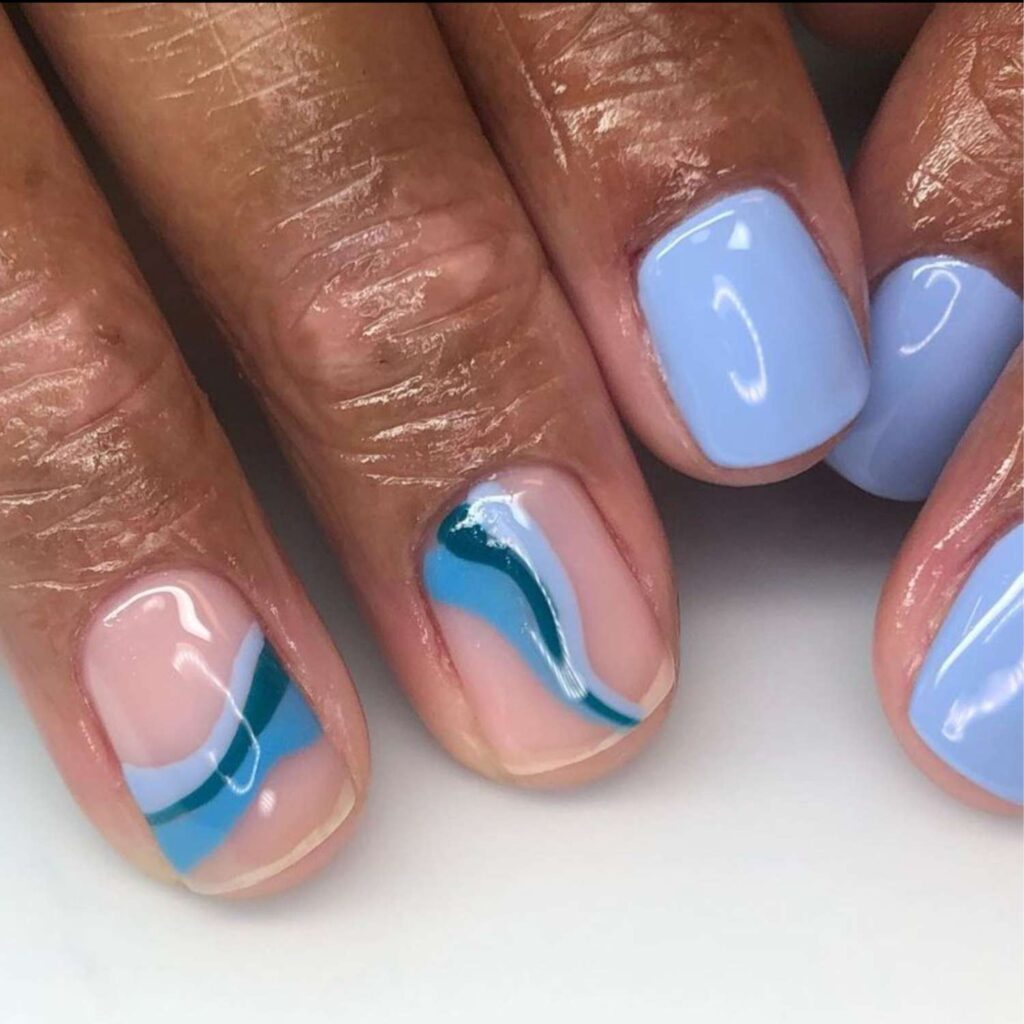 Short periwinkle nails with blue wavy accent lines