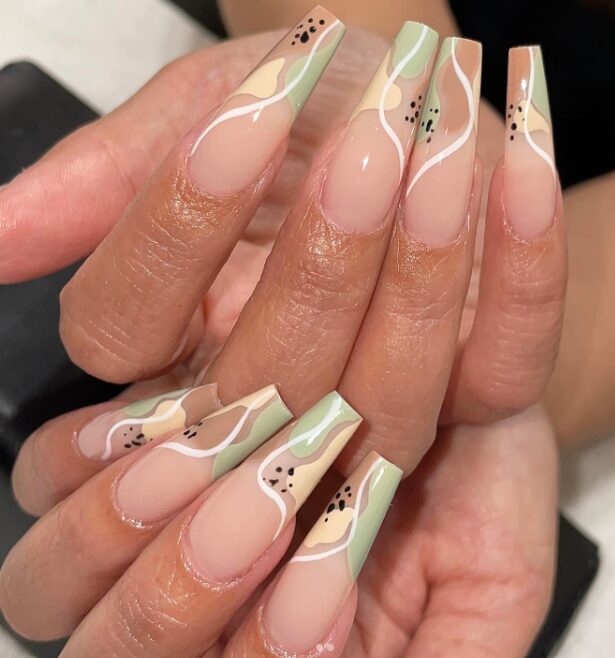nails with abstract pastel designs featuring mint green, beige, and nude tones