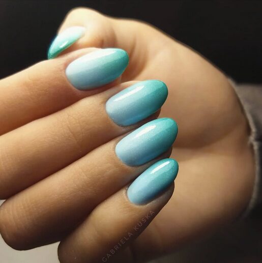 Aqua and sky-blue ombré nails with a smooth glossy finish