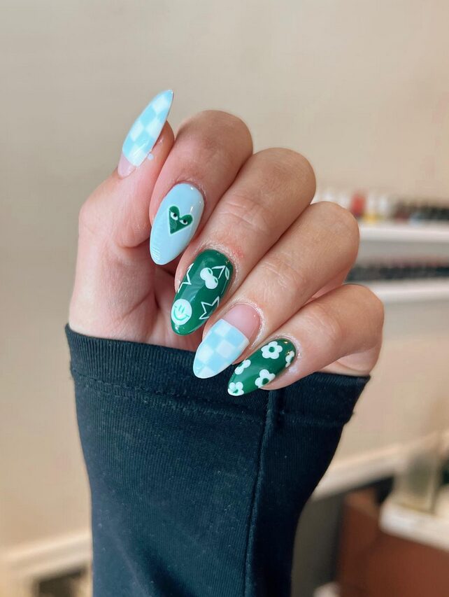 Blue checkered and emerald green nails with cute icons and flowers