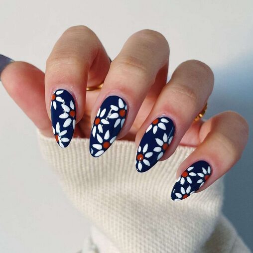 Navy base nails with textured floral art