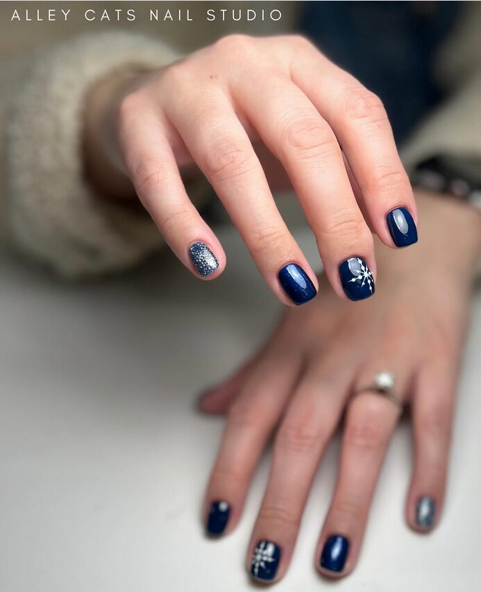 Short square nails painted navy blue