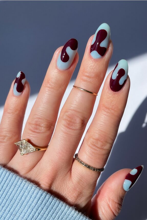 Nails alternating blue and burgundy