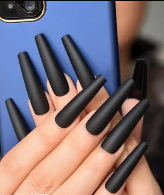 Long matte black coffin nails with a bold, sleek finish