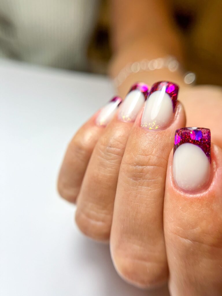 french gel manicure with magenta glitter tips