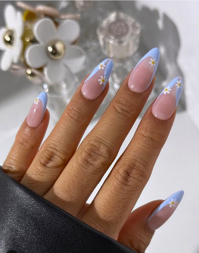 Sky blue French tips with tiny white daisy flowers
