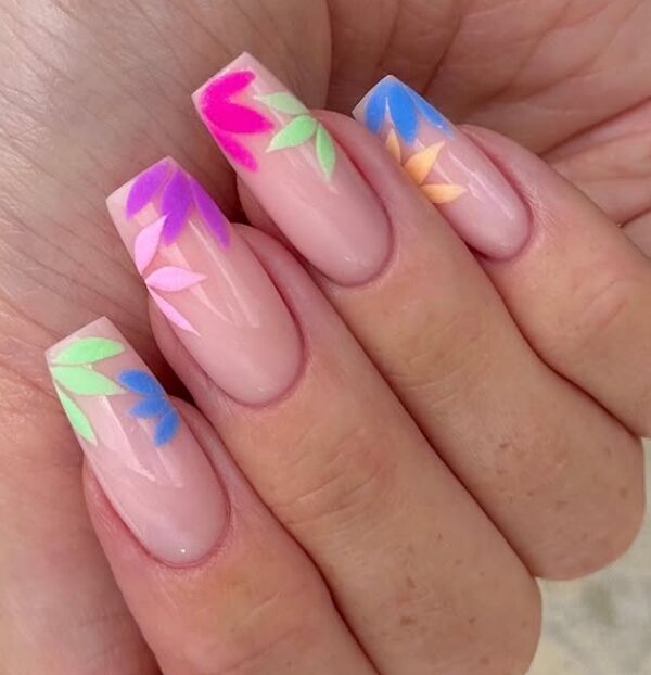nails with a nude base featuring colorful floral leaf designs