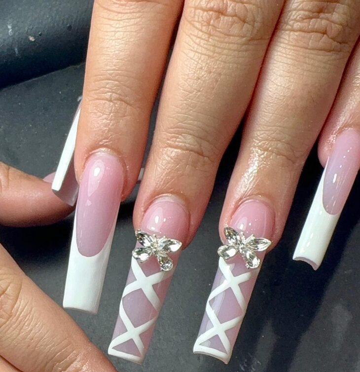 Long white coffin-shaped nails with French tips