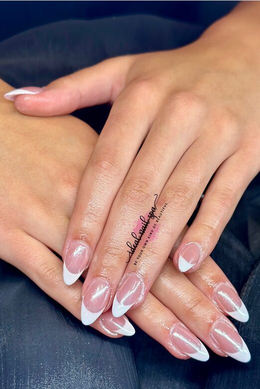 nails with glossy nude bases and crisp white French tips
