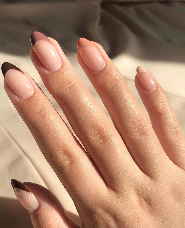 asymmetric french on short nails closeup