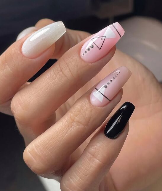nails with a modern geometric design featuring minimalist lines and dotted patterns