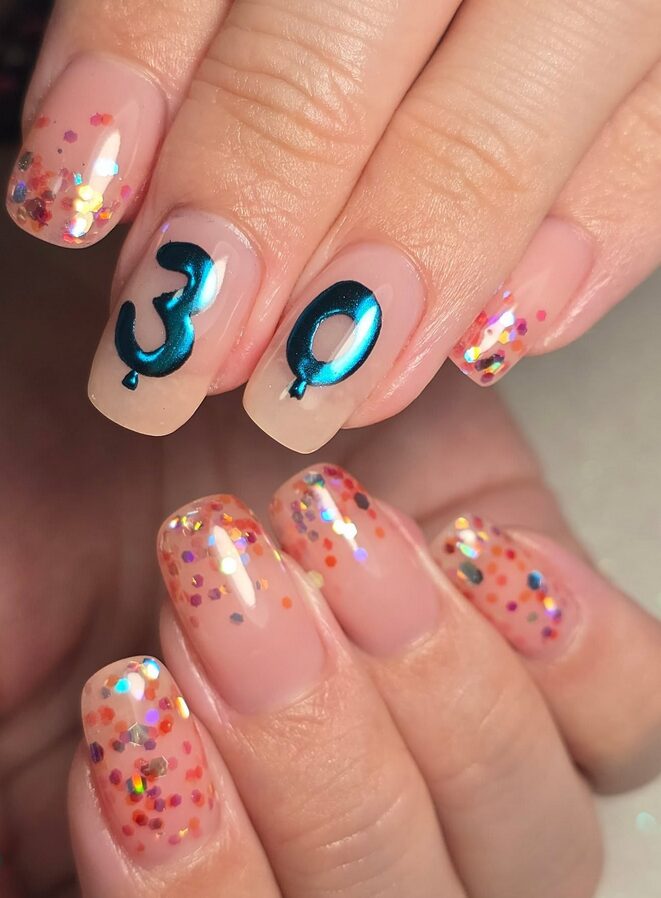 nails with colorful glitter tips and metallic blue