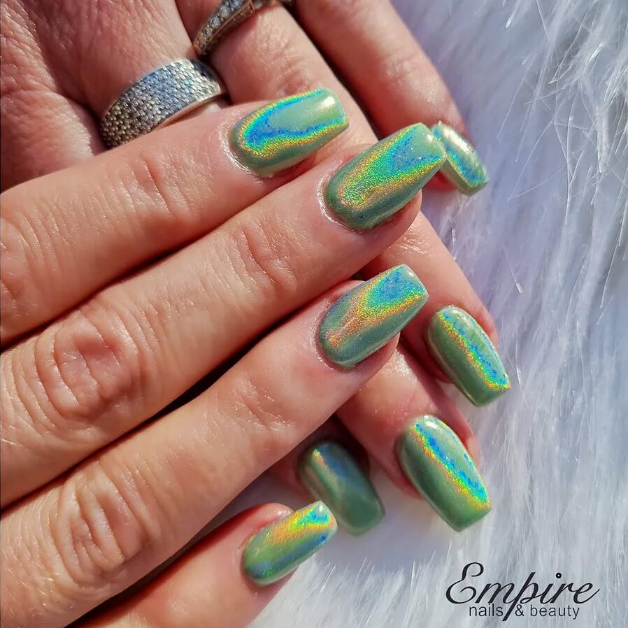 medium-length square nails featuring a green holographic chrome finish