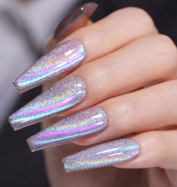 nails with a holographic chrome finish reflecting shades of silver, pink, and blue