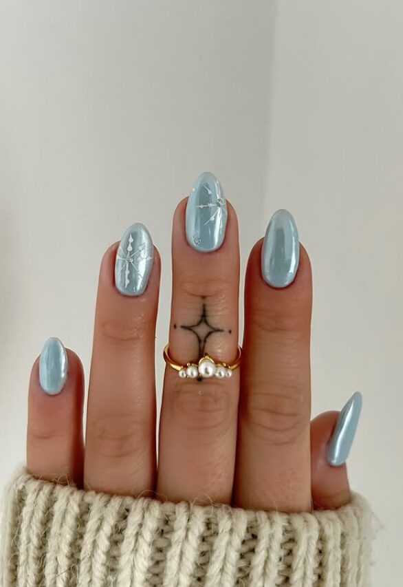 light icy blue almond nails with subtle white accents