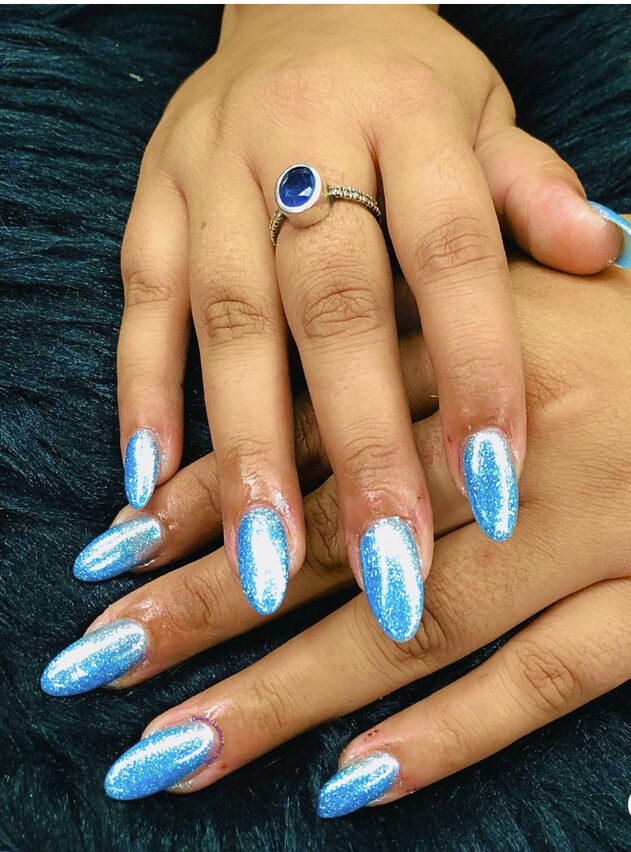 Sparkly light blue glitter nails on almond shape