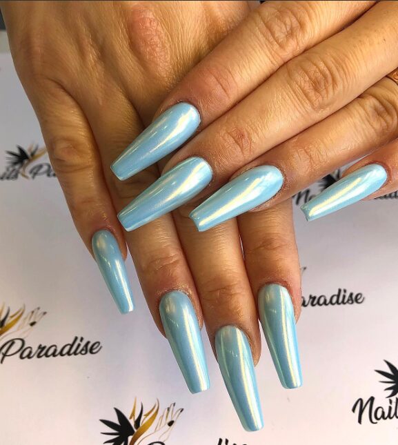 nails coated in a glossy baby blue chrome finish