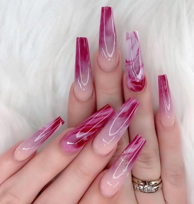 Extra-long coffin nails with a glossy nude-to-berry gradient and pink marble detailing