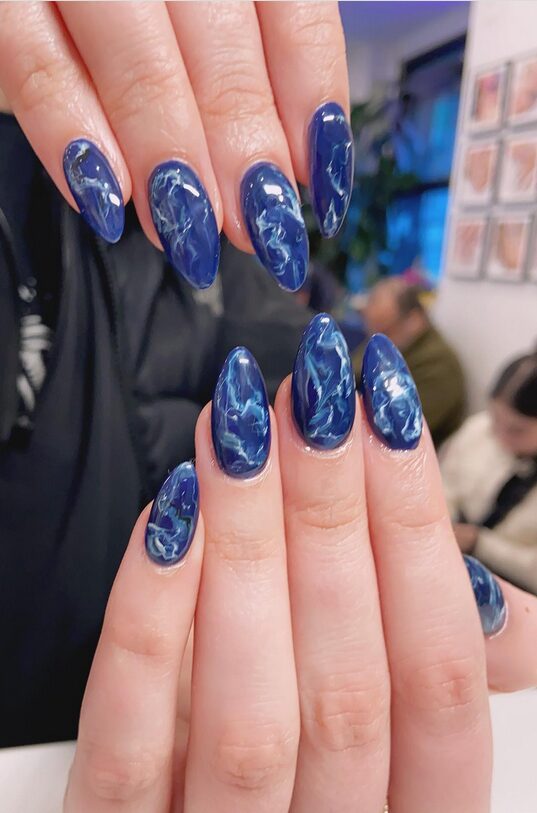 Marble-accent design on navy base with white veins