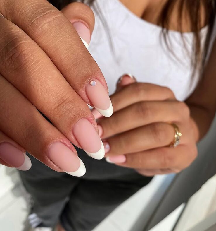 Close-up of matte French manicure in neutral tones