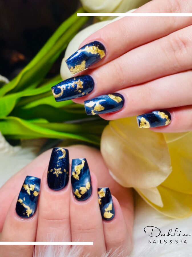 Navy blue nails with gold foil or line details